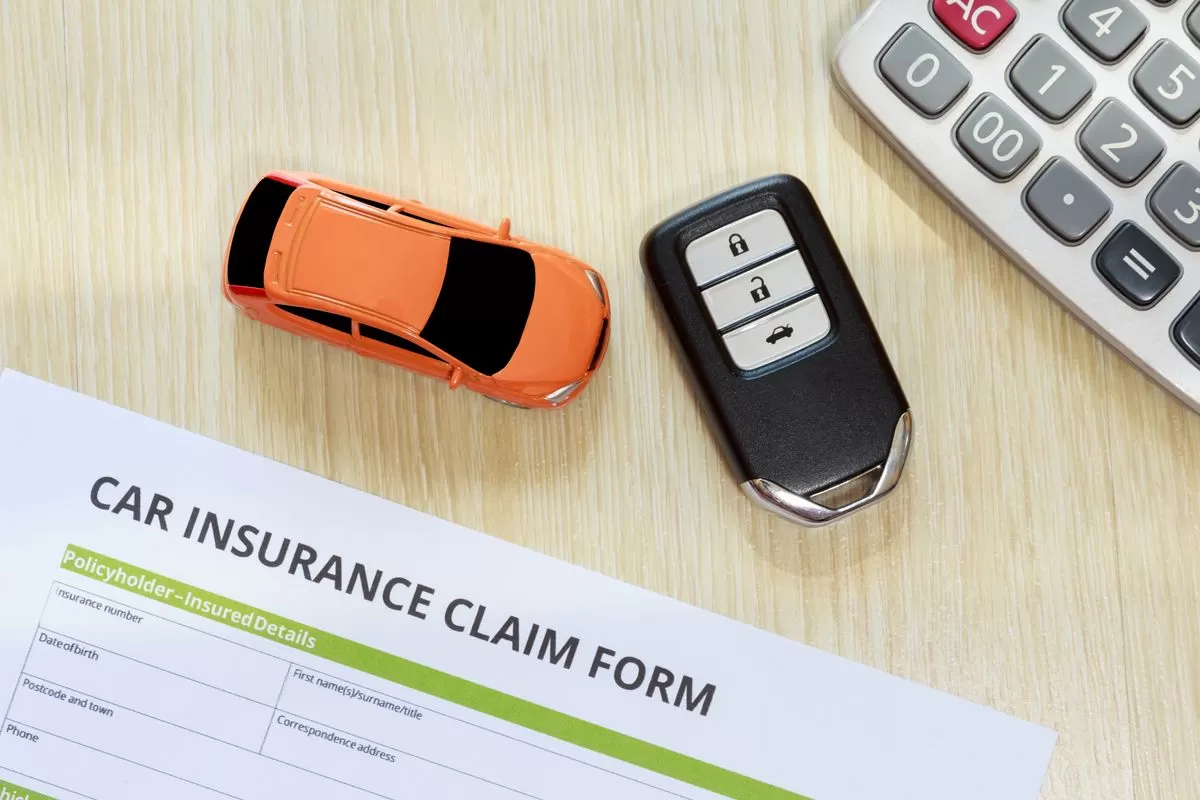 car-insurance-claim-form-with-toy-and-key-on-table-royalty-free-image-1583581112-1071605038